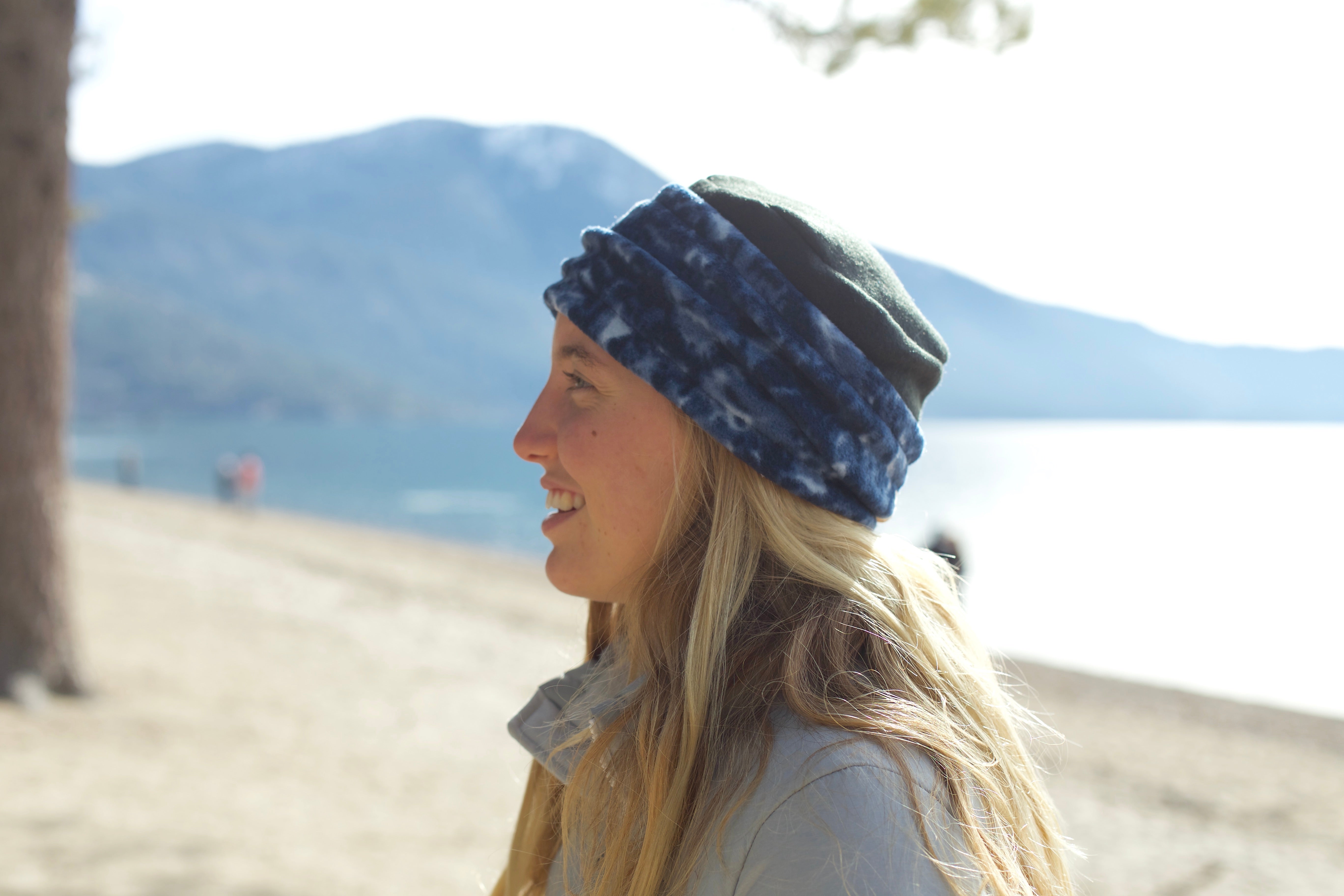 woman in Warm Hat. Fleece hat by Luvcali. marbled navy blue.