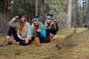 Girls wearing polka dot hats.